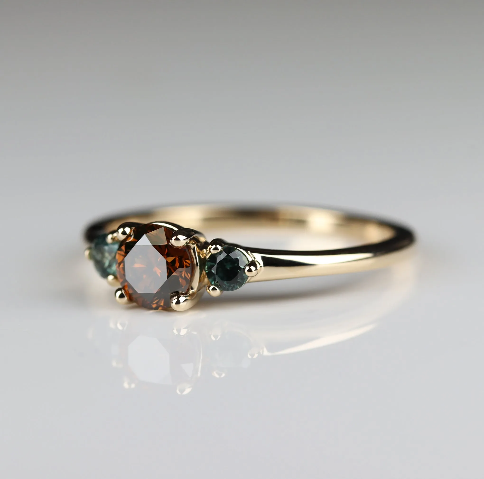 Three Stone Ring with Cognac Diamond and Sapphire Side Stones