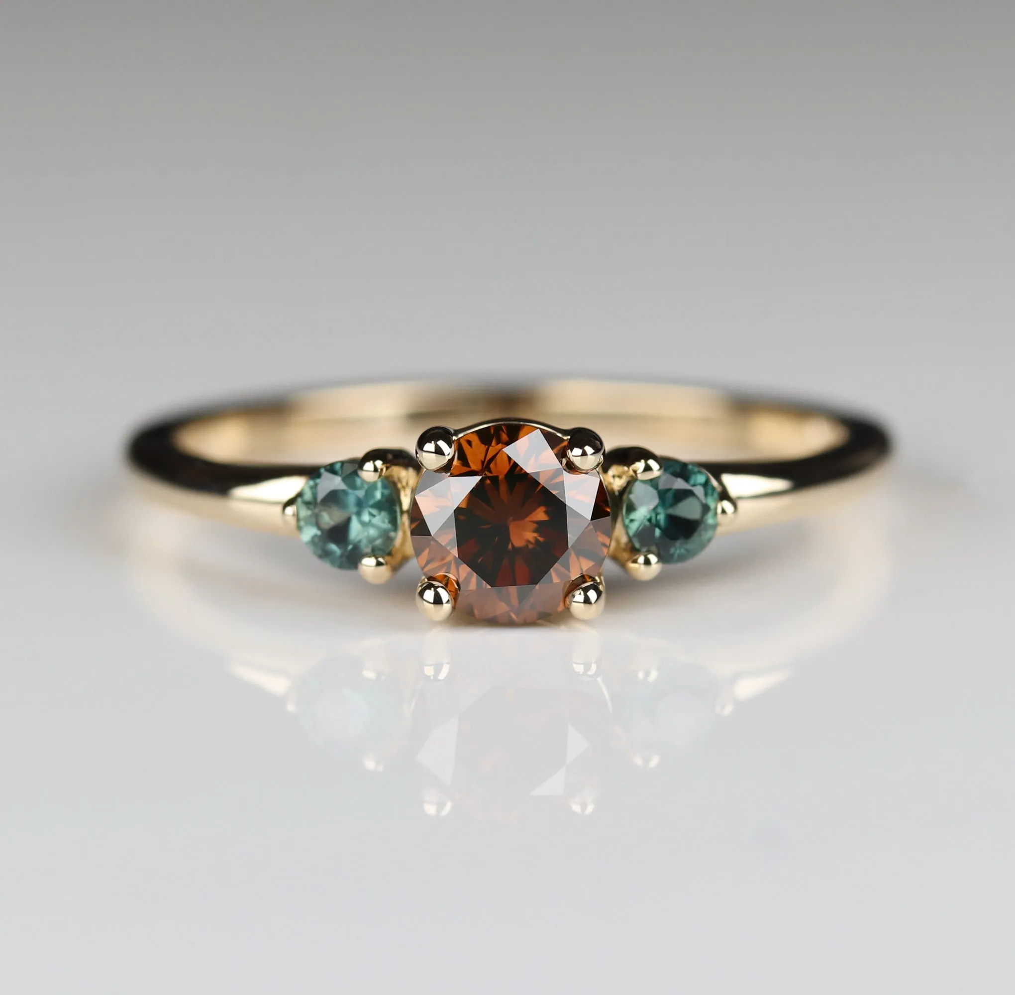 Three Stone Ring with Cognac Diamond and Sapphire Side Stones